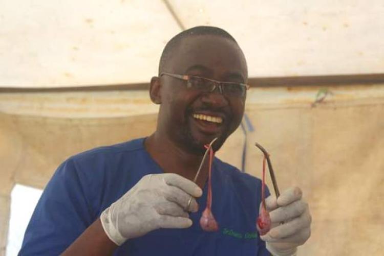 Dr Ochwangi holds cats organs